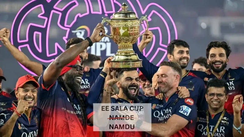 Ee Sala Cup Namdu Meaning In Hindi: नारा, RCB और जीत का मतलब! 9 ई साला कप नमदु (ESCN) का इतिहास: बैंगलोर के प्रशंसकों का नारा कैसे बना (Ee Sala Cup Namdu (ESCN) ka Itihas: Bangalore ke Fans ka Nara Kaise Bana) इस नारे की उत्पत्ति, विकास और लोकप्रियता की कहानी जानें।